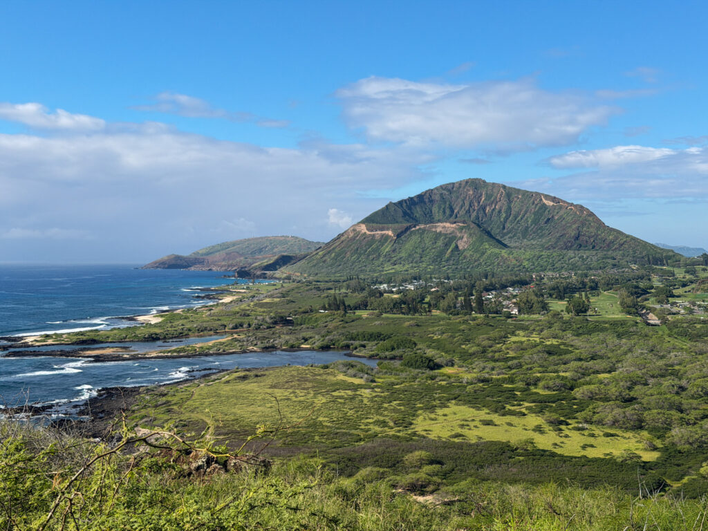 Lush coastal mountains and shoreline landscape near the Makapuʻu Lighthouse Trail in Oahu