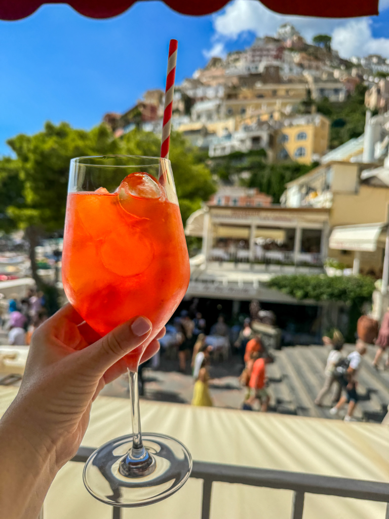 Aperol spritz with a view from Buca di Bacco in Positano