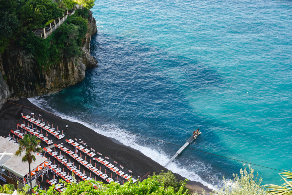 Overlook of Arienzo Beach Club and turquoise water in Positano