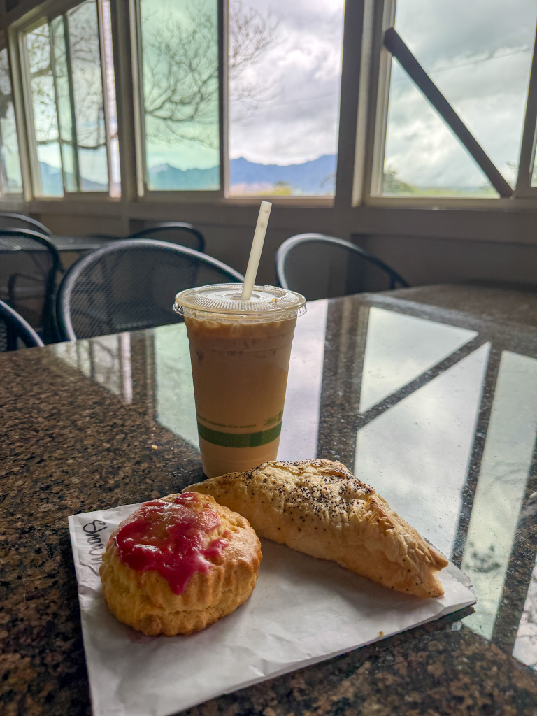 iced coffee and pastries at Green World Coffee Farm with mountain views in Oahu
