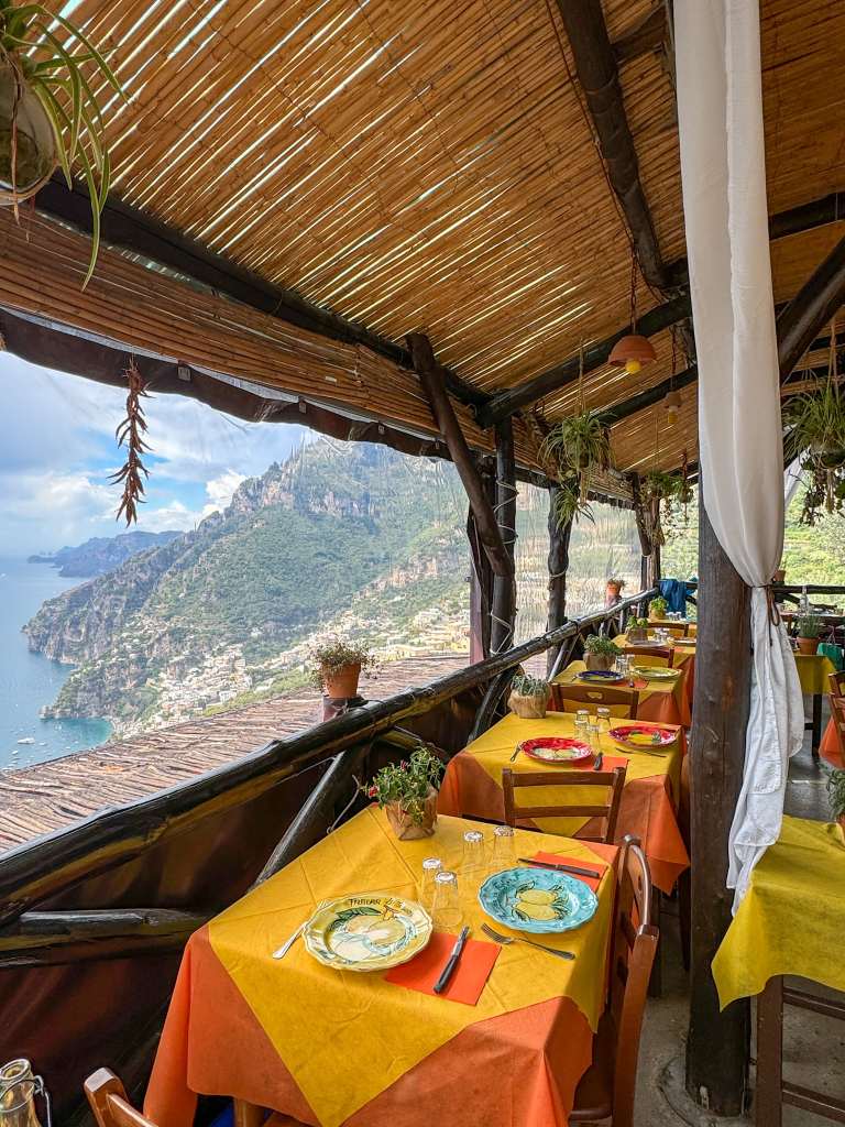 Inside La Tagliata restaurant with a view over Positano