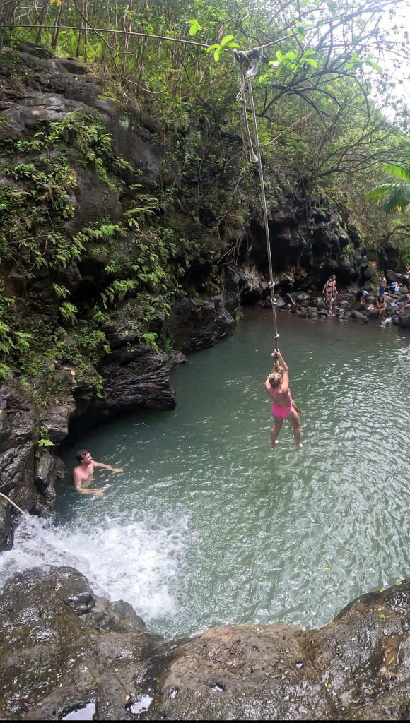 Rope swing over the natural pool at Waimano Falls, one of Oahu’s best waterfall hikes